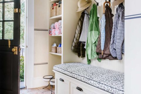 white entrance with coats