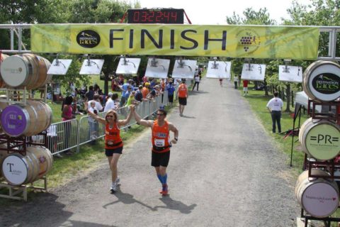 runners crossing finish line