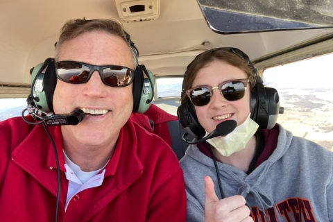 instructor and child in plane