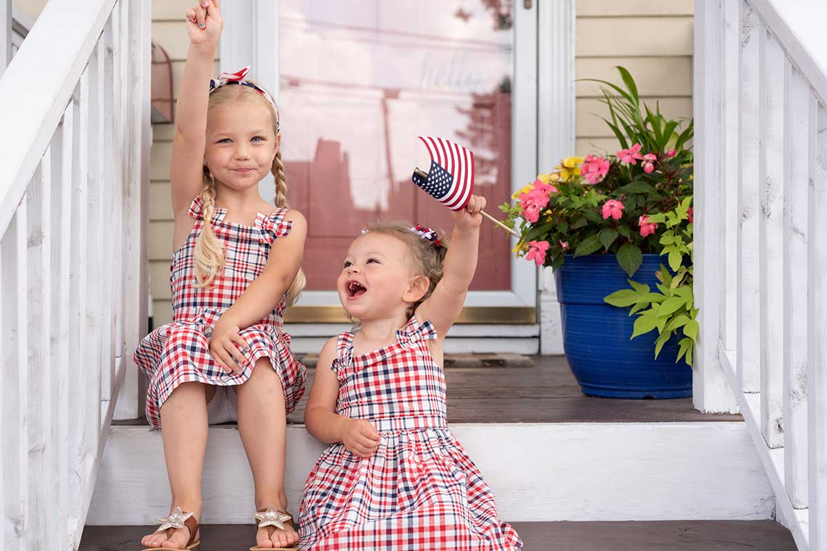 two kids holding flags
