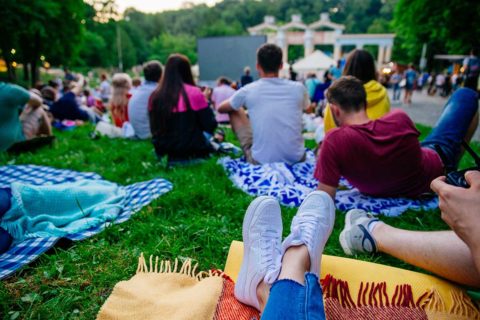 people watching outdoor movie