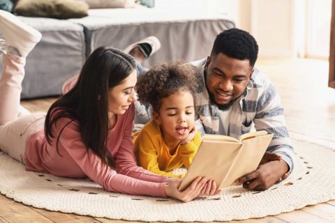 family reading a book