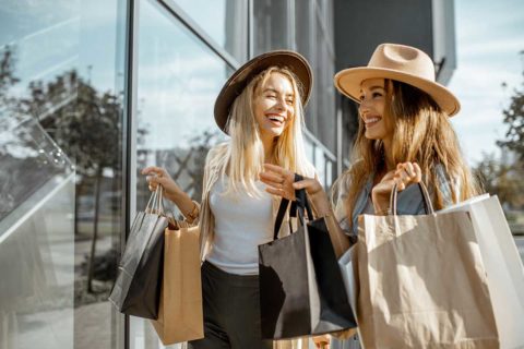 women holding shopping bags
