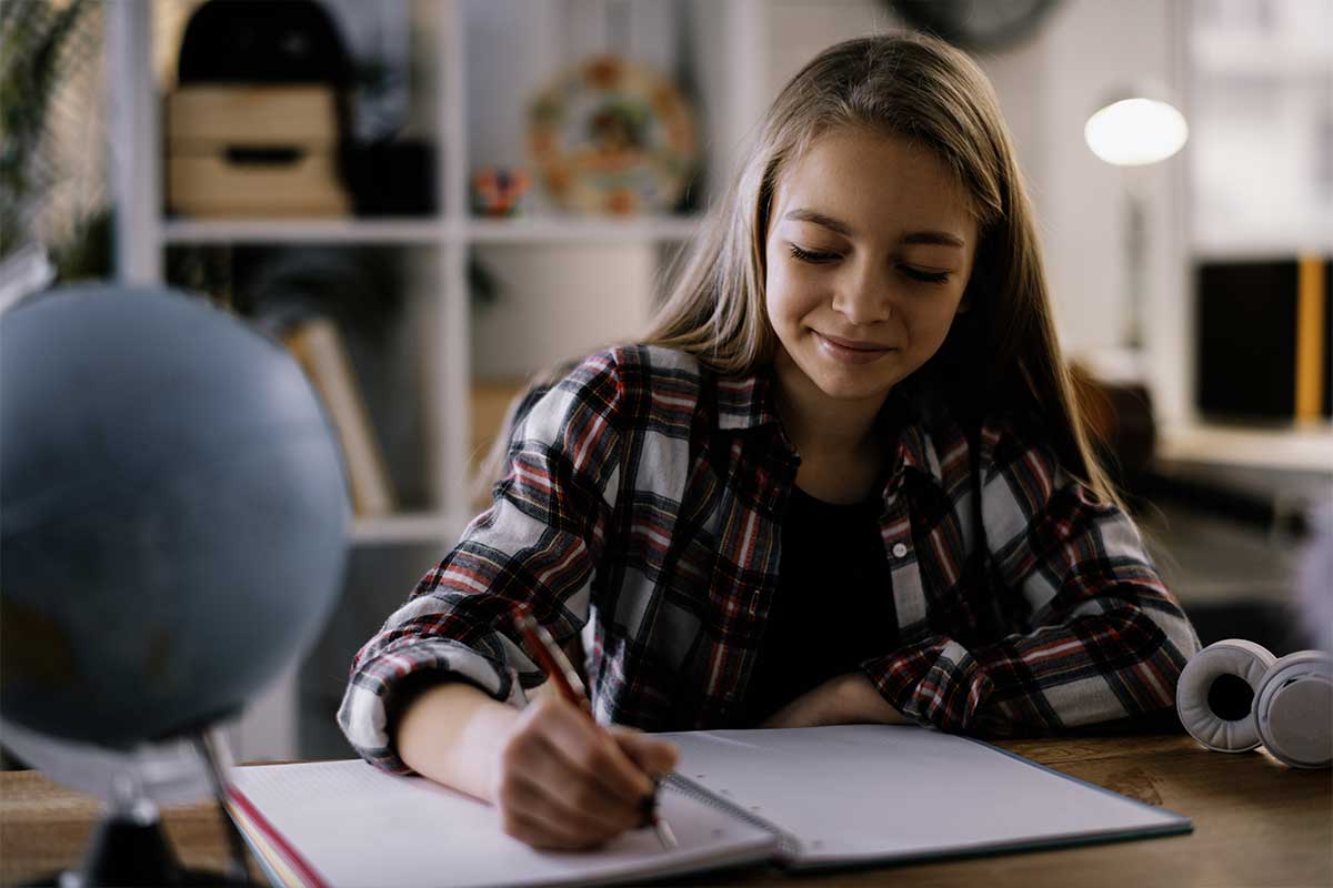 teen girl writing