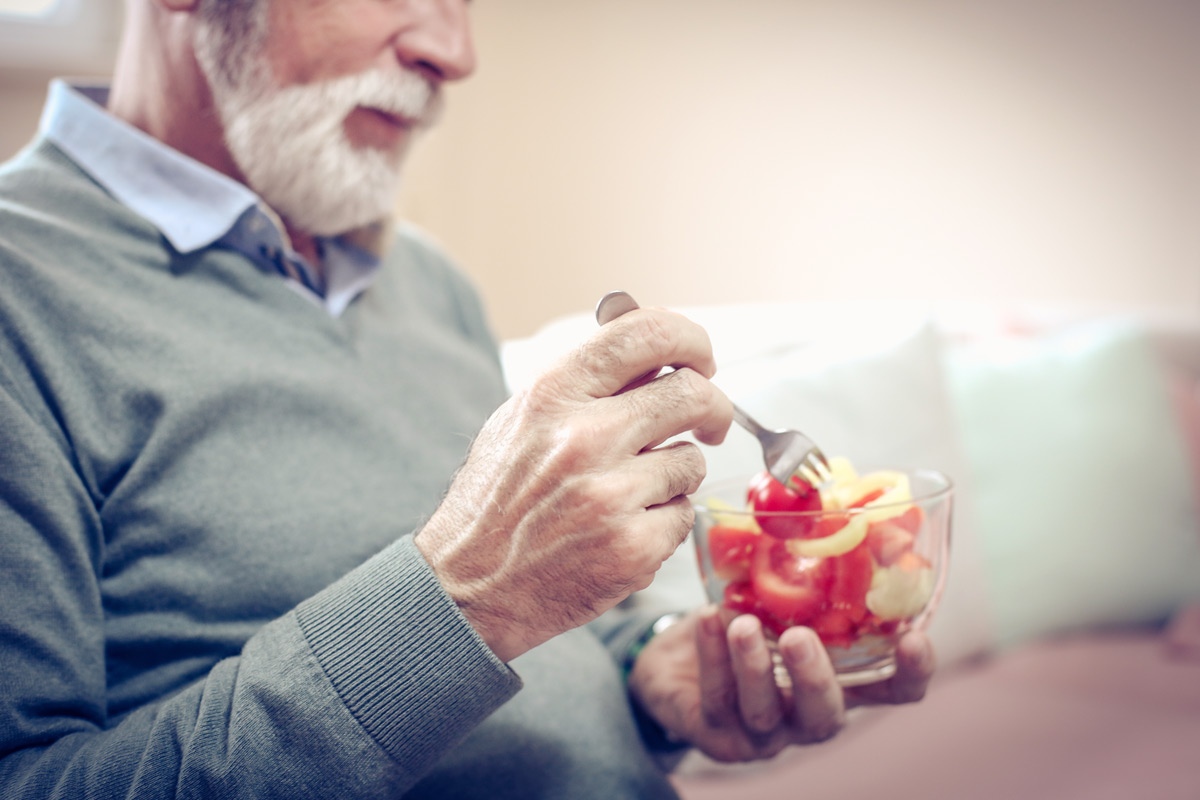 man eatting veggies