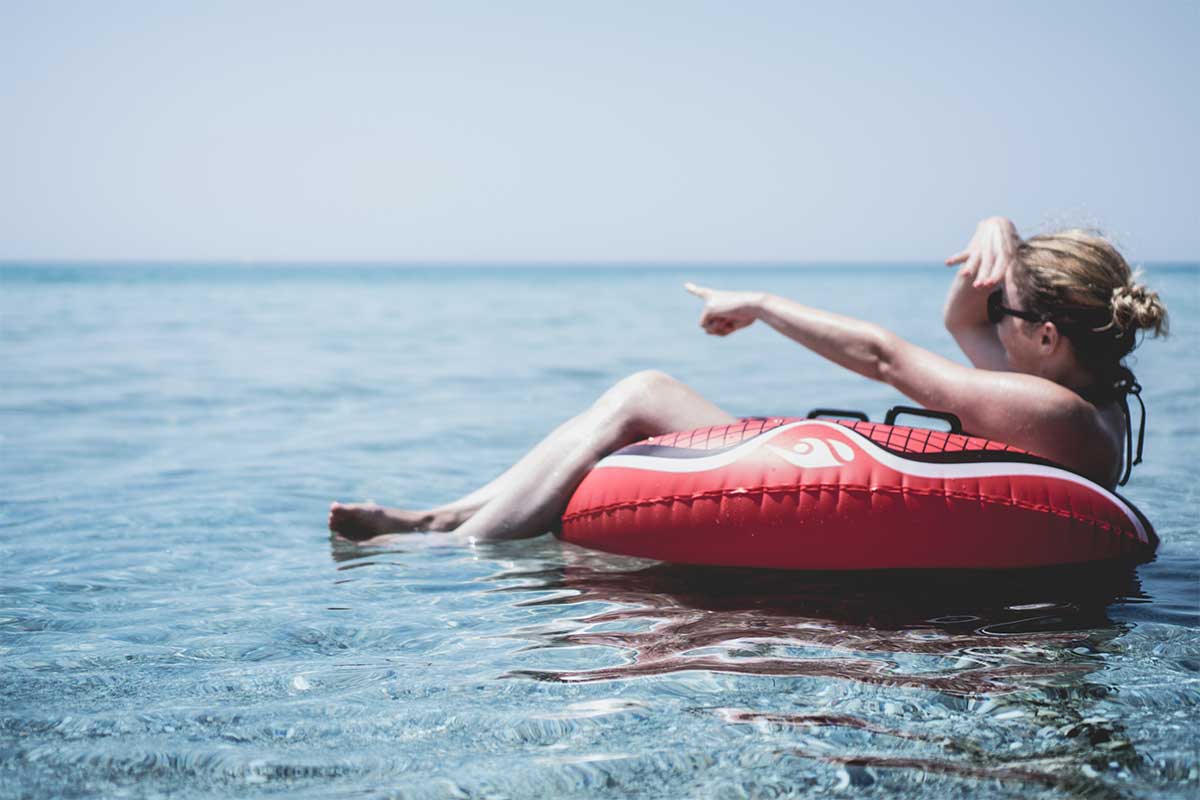 woman in tube on water