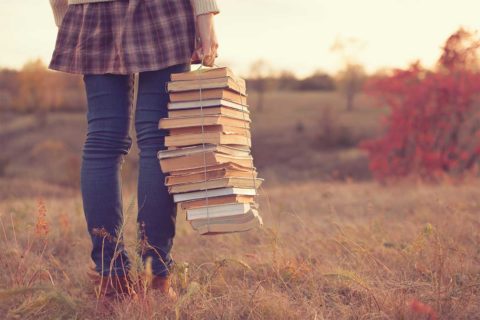 woman carrying books