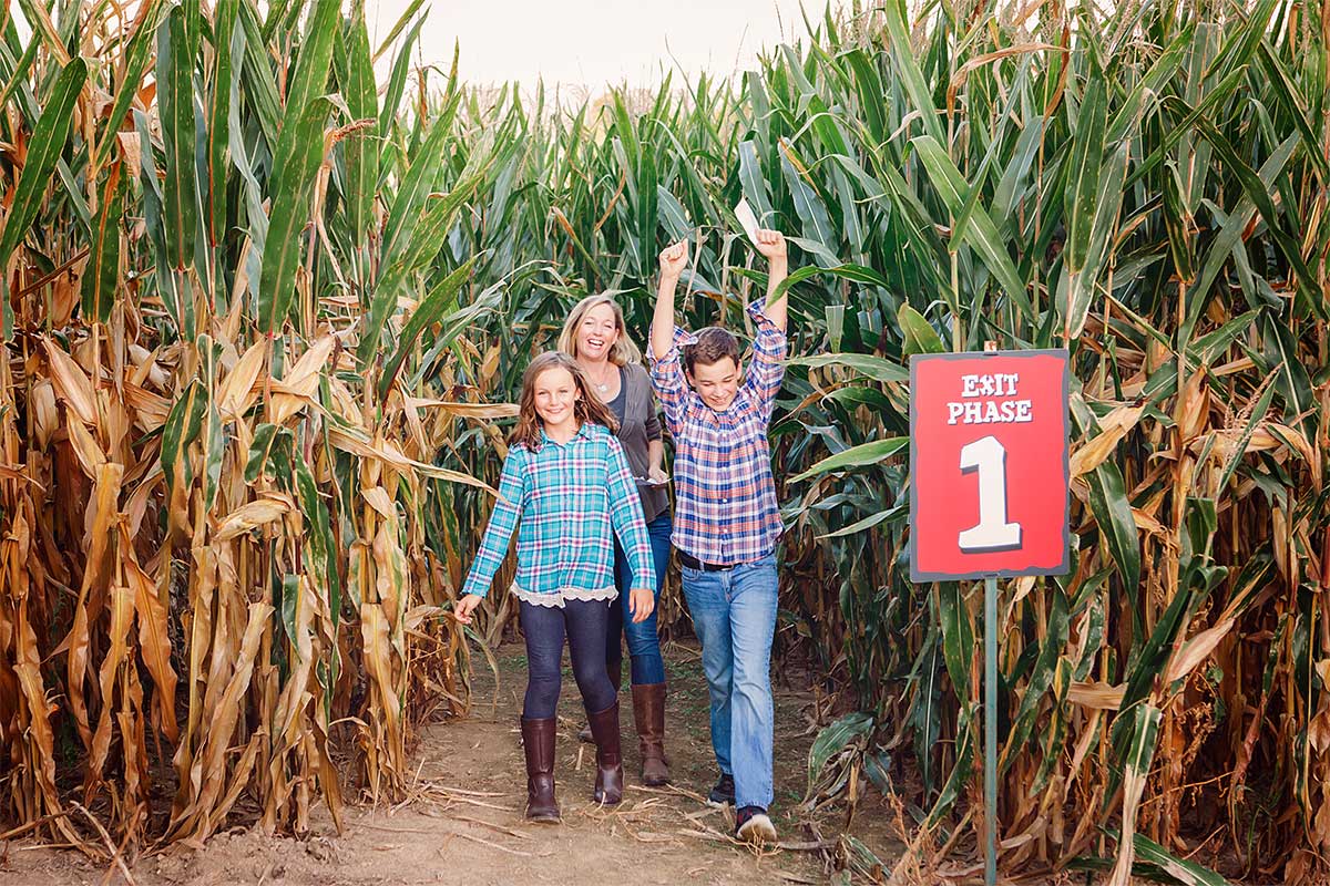 family walking out of corn maze