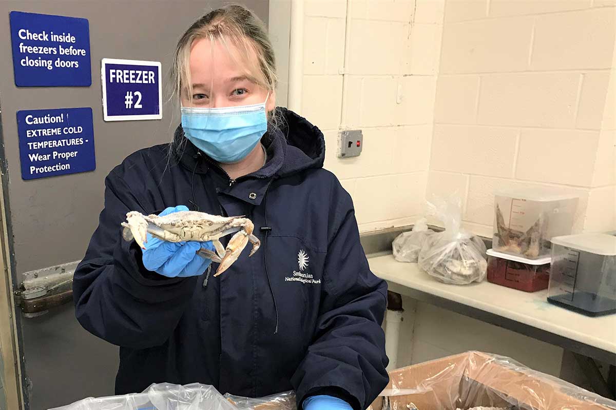woman holding crab