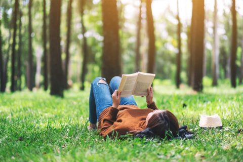 child reading outside