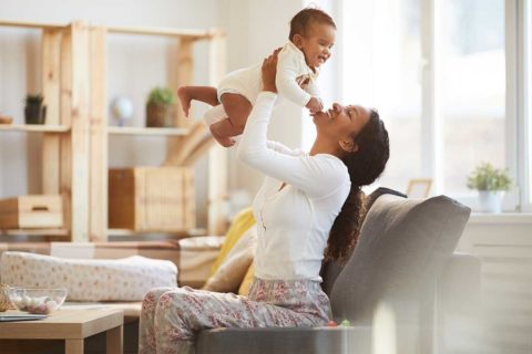 mom playing with baby