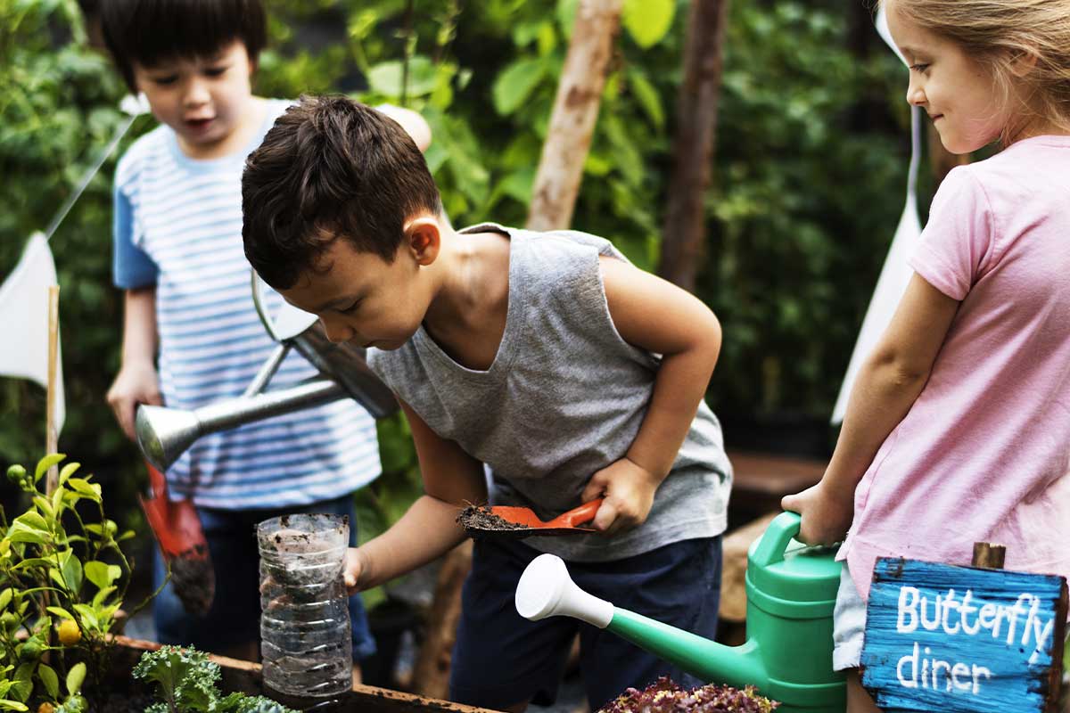 children digging in garden