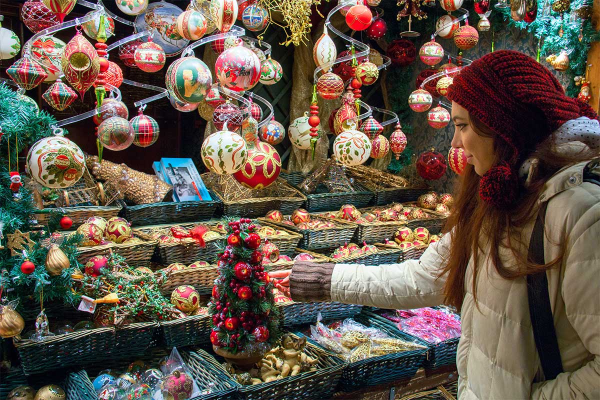 woman looking at holiday market booth