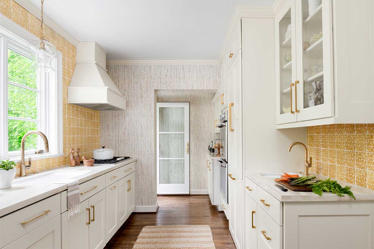 yellow kitchen with white cabinets