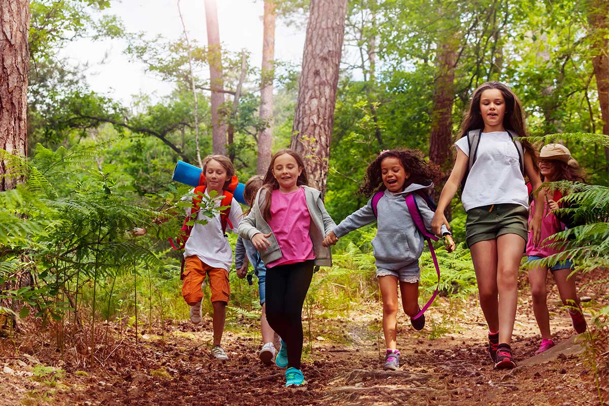 children running in wood