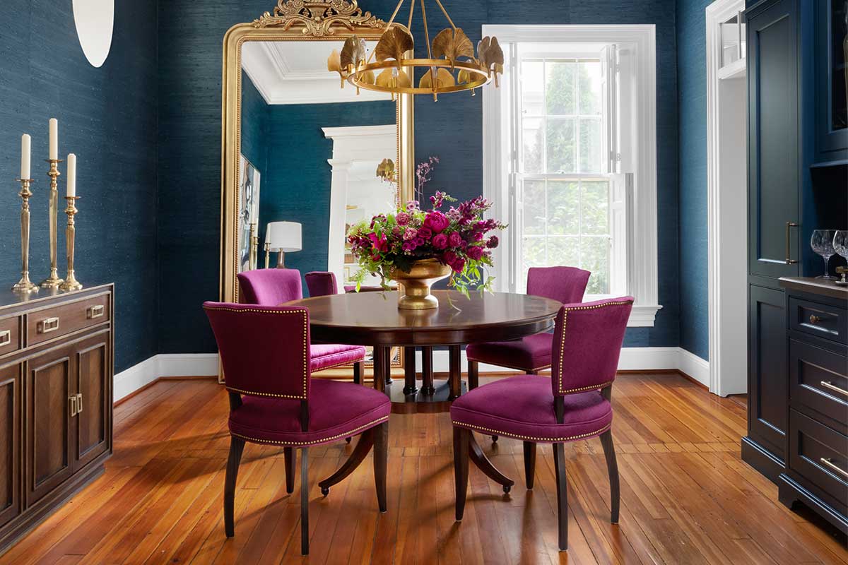 blue dining room with purple chairs