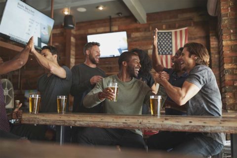 cheering at sports bar