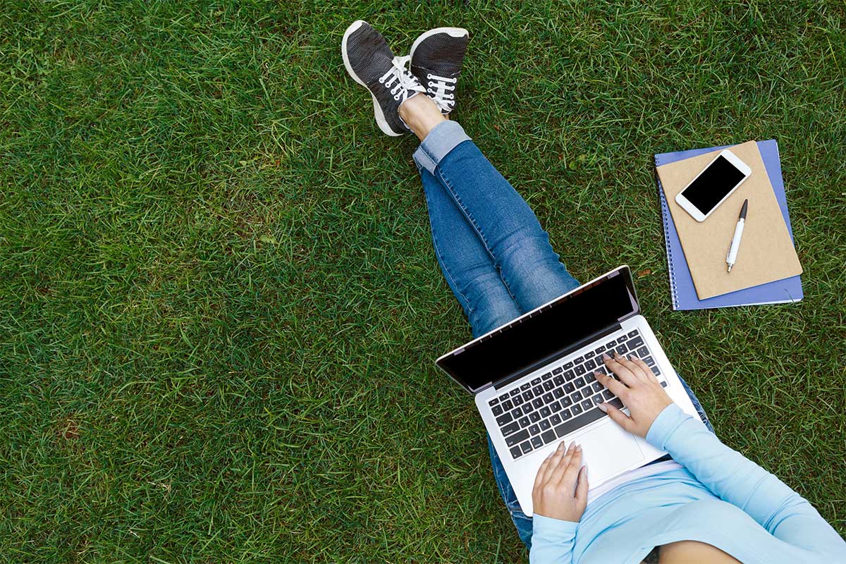working on laptop outside