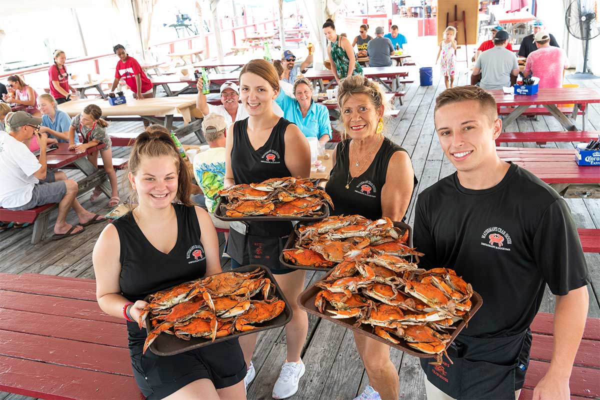 waiters holding crabs