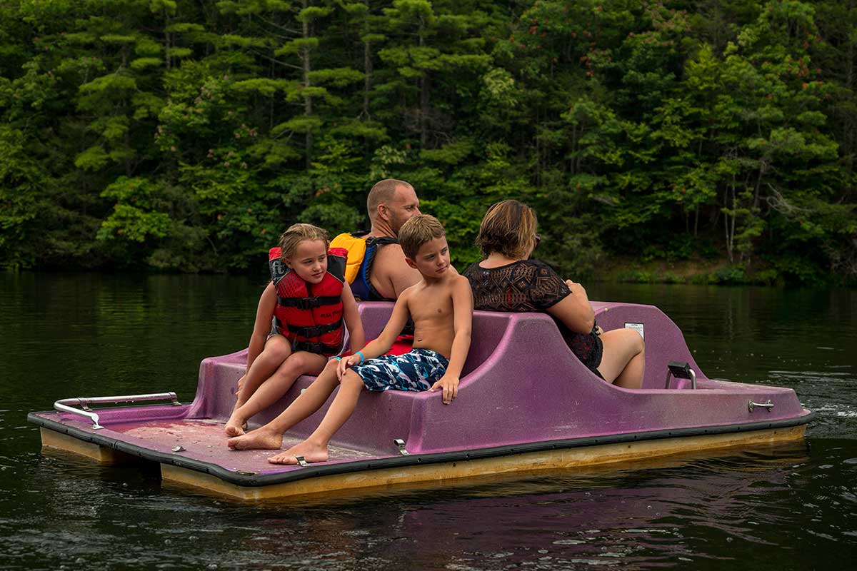 family on paddle boat
