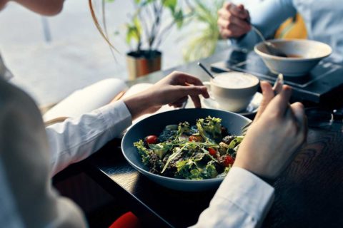 woman eating salad