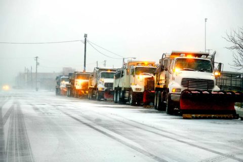 snow plows on side of road