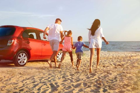 family running on beach