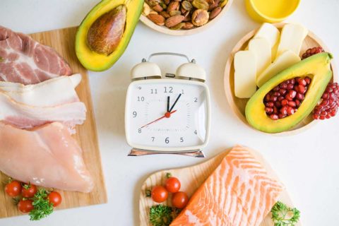 clock surrounded by food