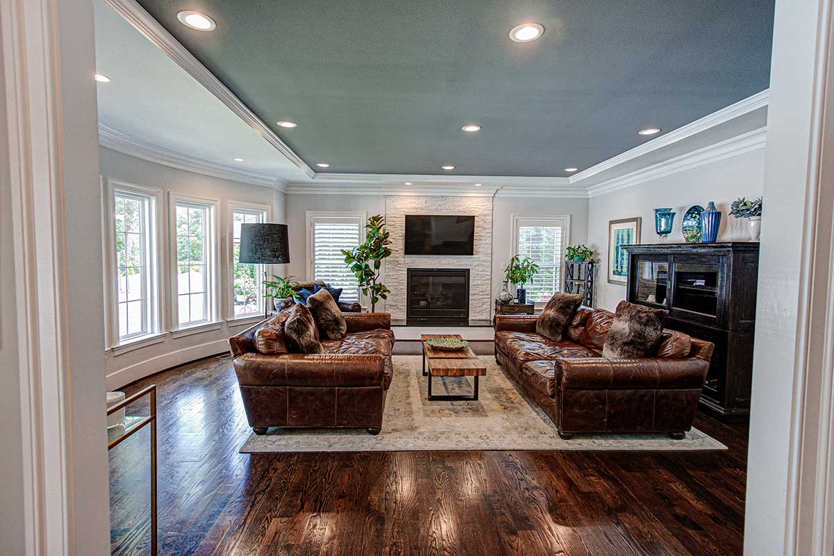 white and grey living room with hardwood floors