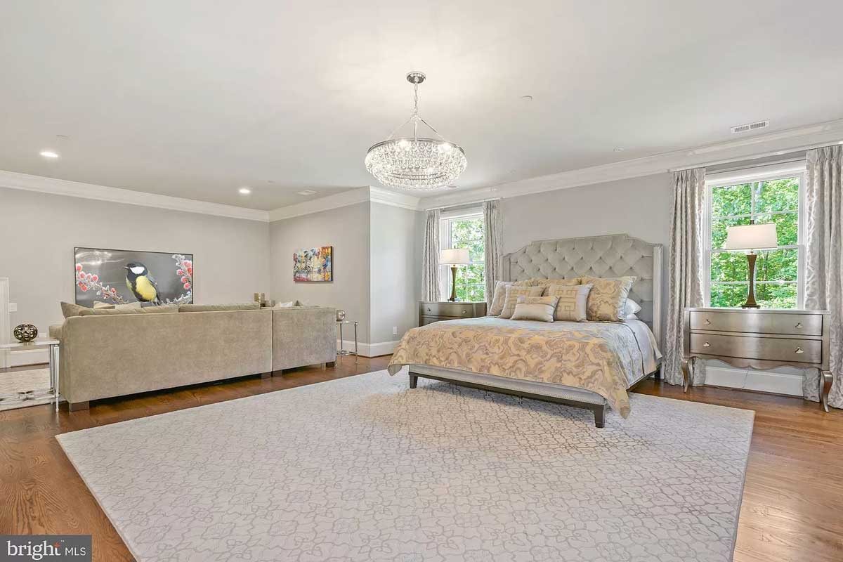 white bedroom with sitting area