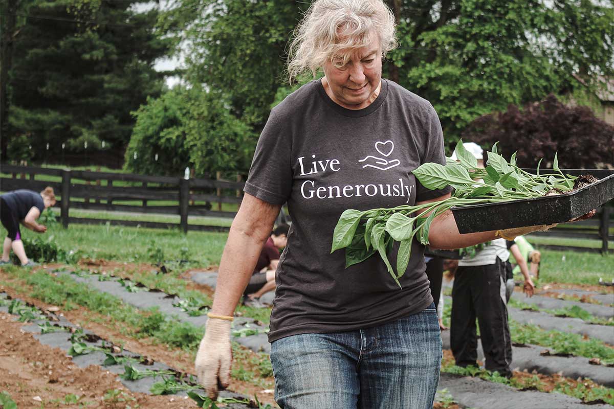 woman carrying vegetables