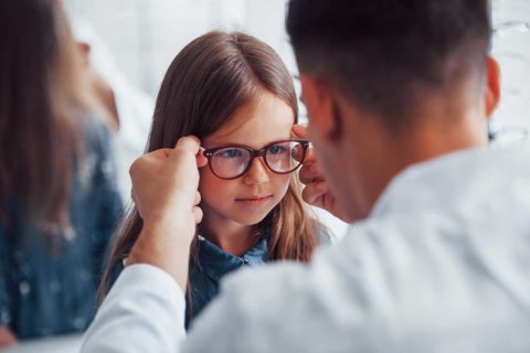 child at eye doctor