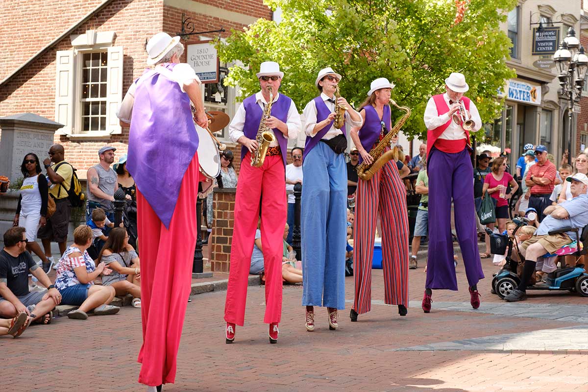 performers on stilts
