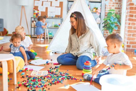 teacher playing with children