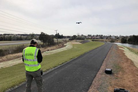 man flying drone