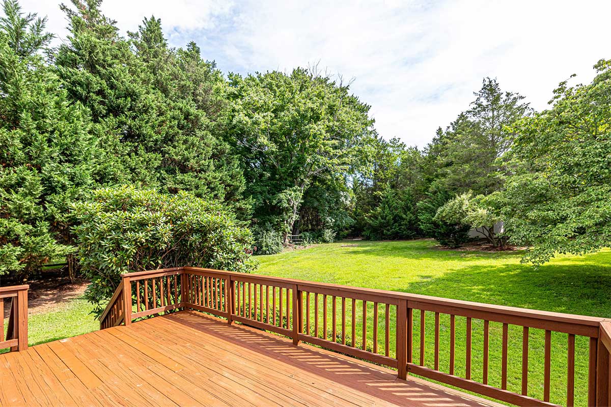 backyard with deck and trees