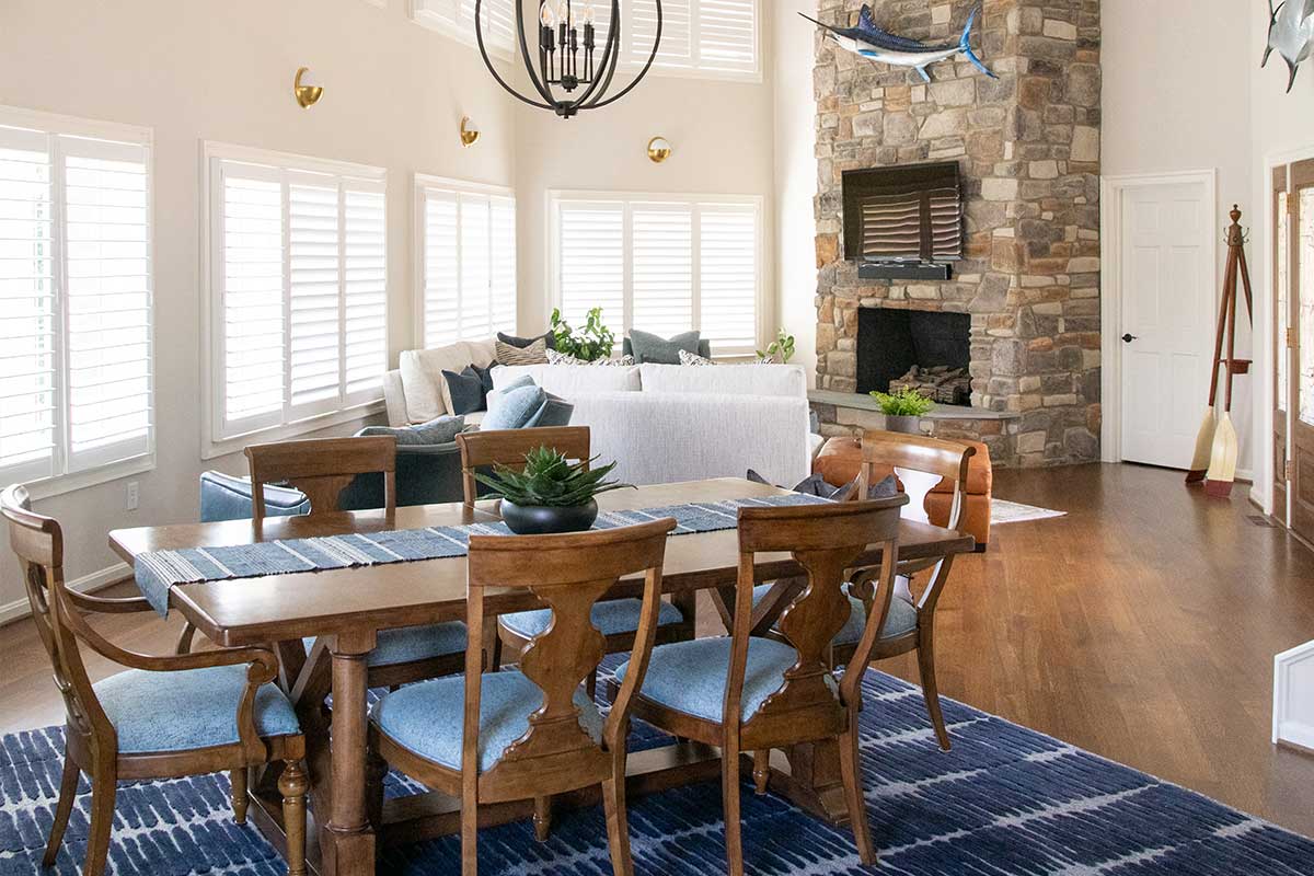 wood dining table over blue and white rug