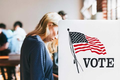 woman at voting booth