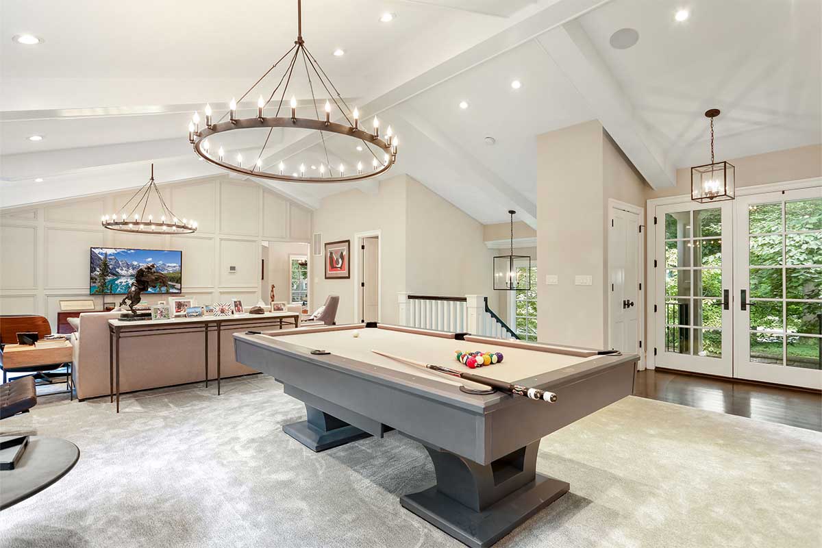 white living room with pool table