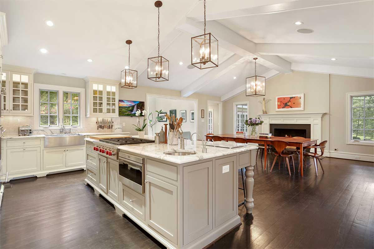 white kitchen with vaulted ceiling