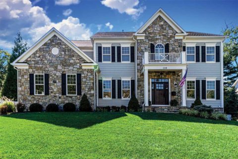 stone and paneled exterior home