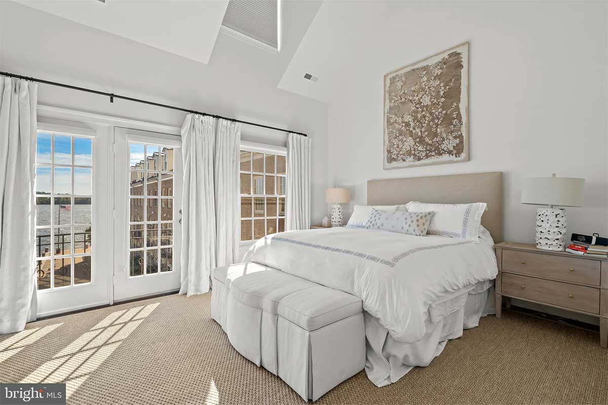white bedroom with water views