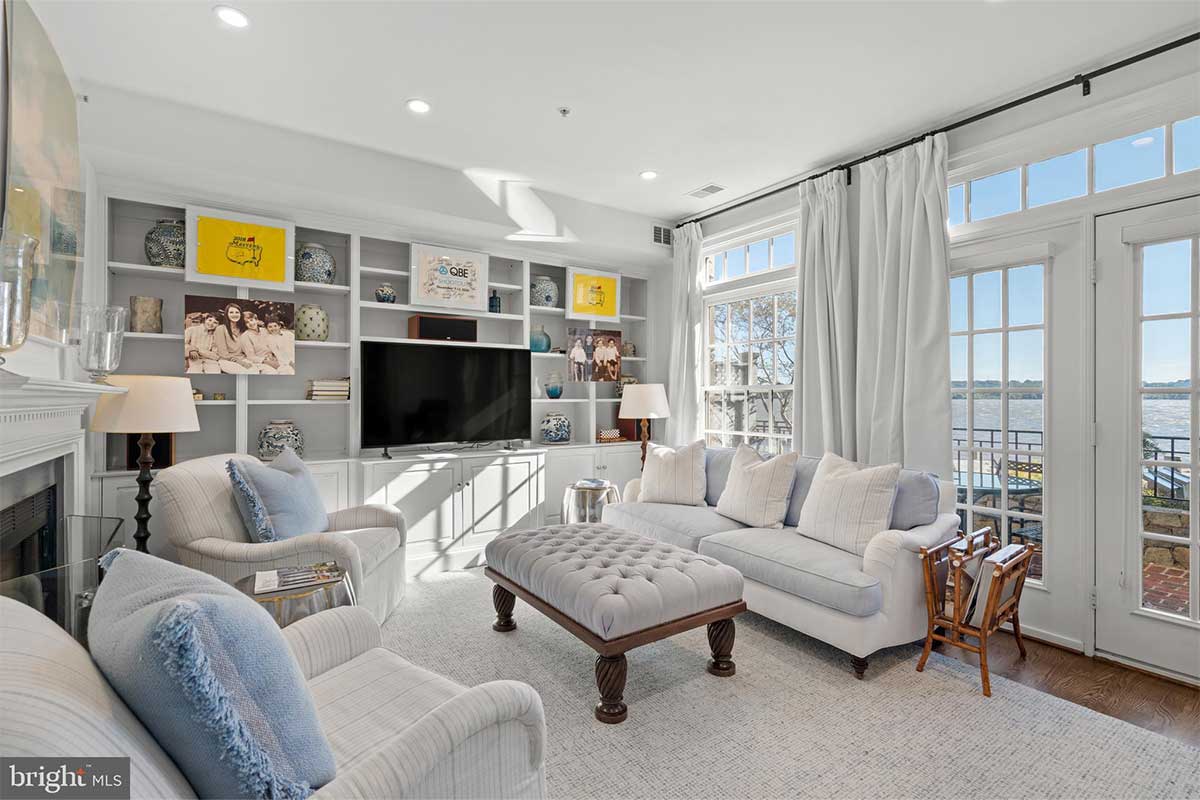 living room with built ins and fireplace