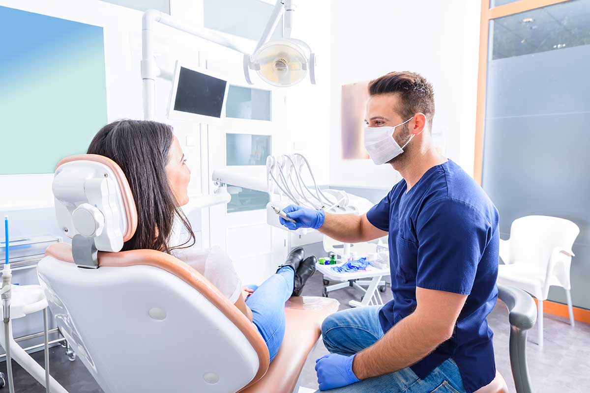 dentist with patient at dentist office