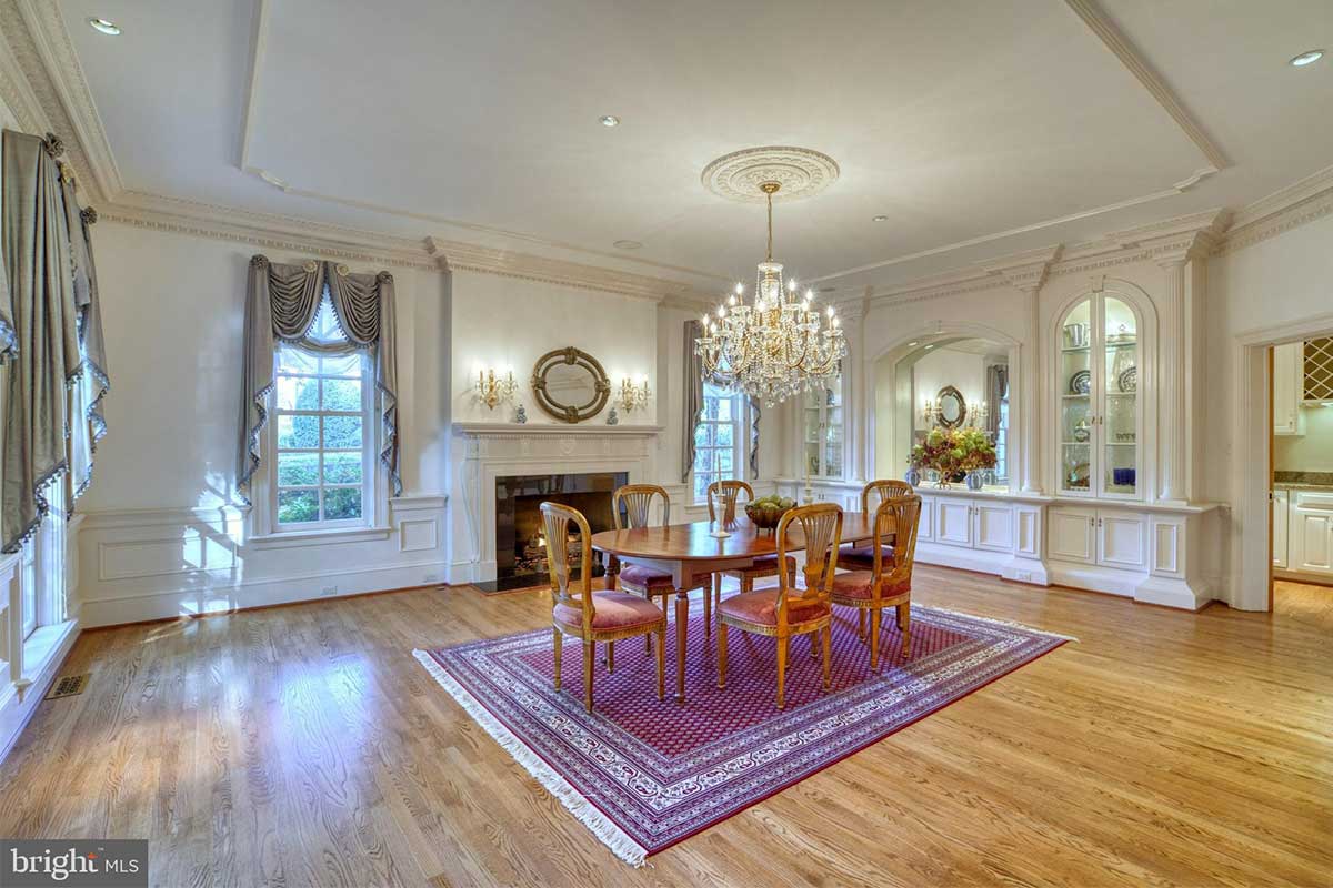 dining room with crown molding and fireplace