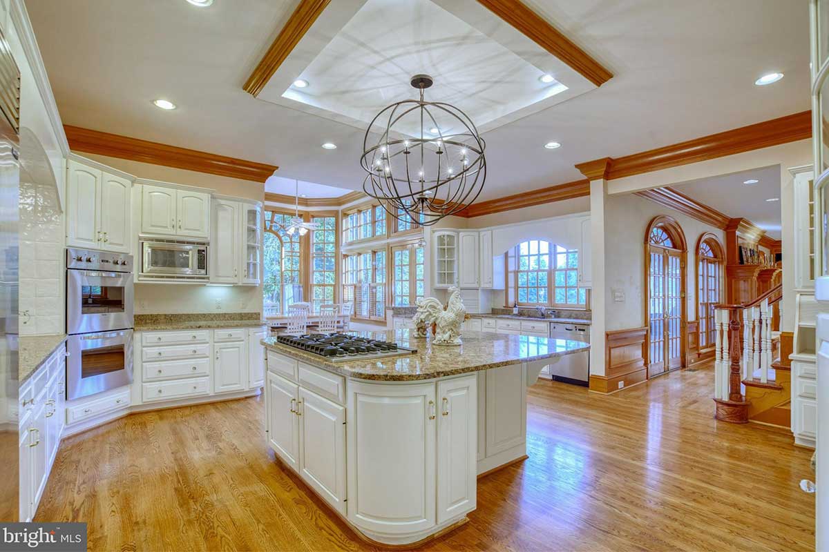 white kitchen with wood trim