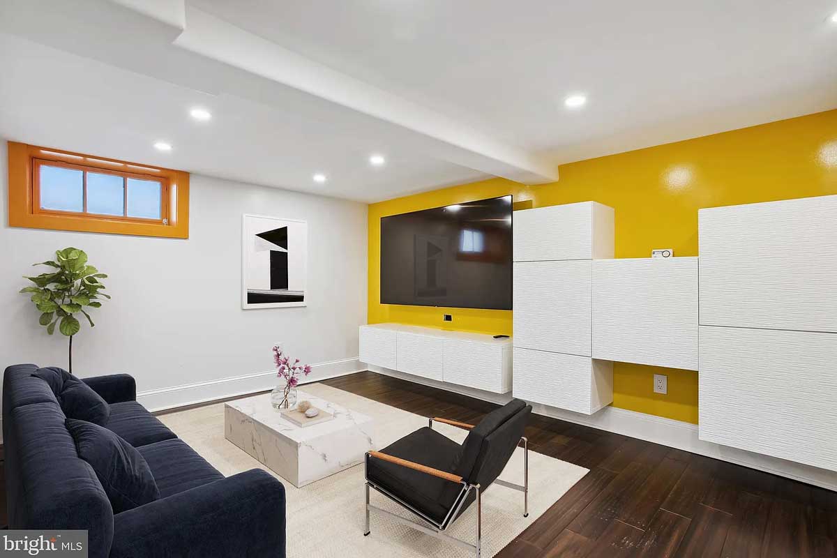 recreation room with yellow accent wall
