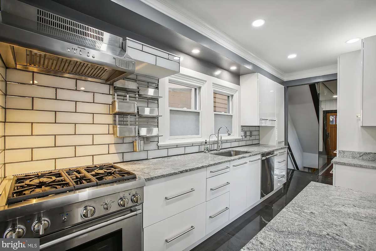 kitchen with white cabinets and gray countertops