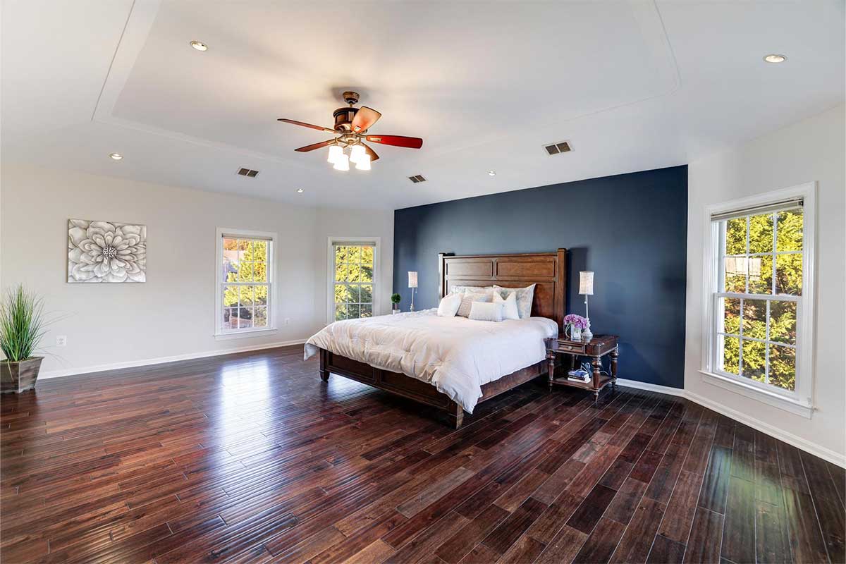 bedroom with navy accent wall