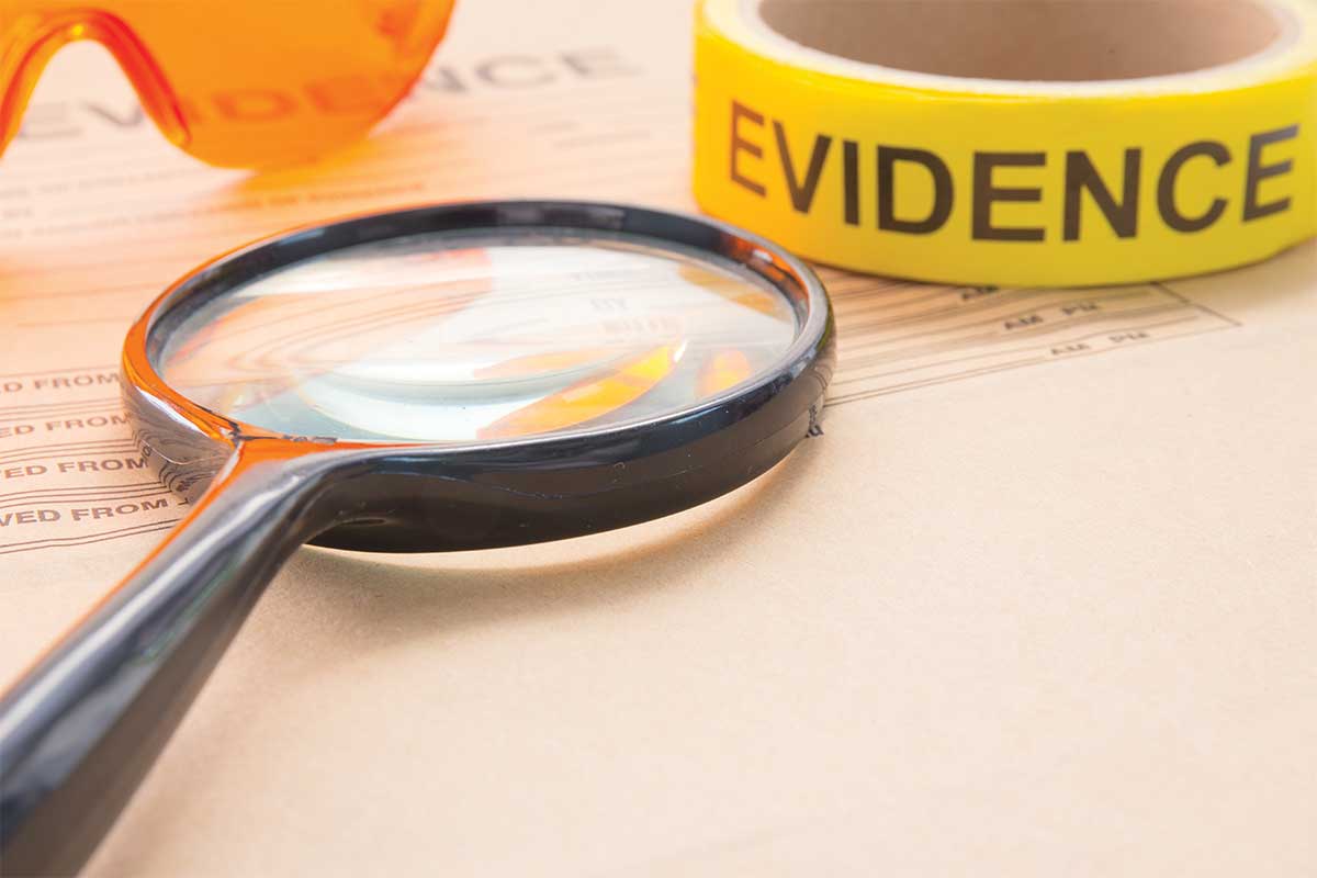 magnifying glass and evidence tape